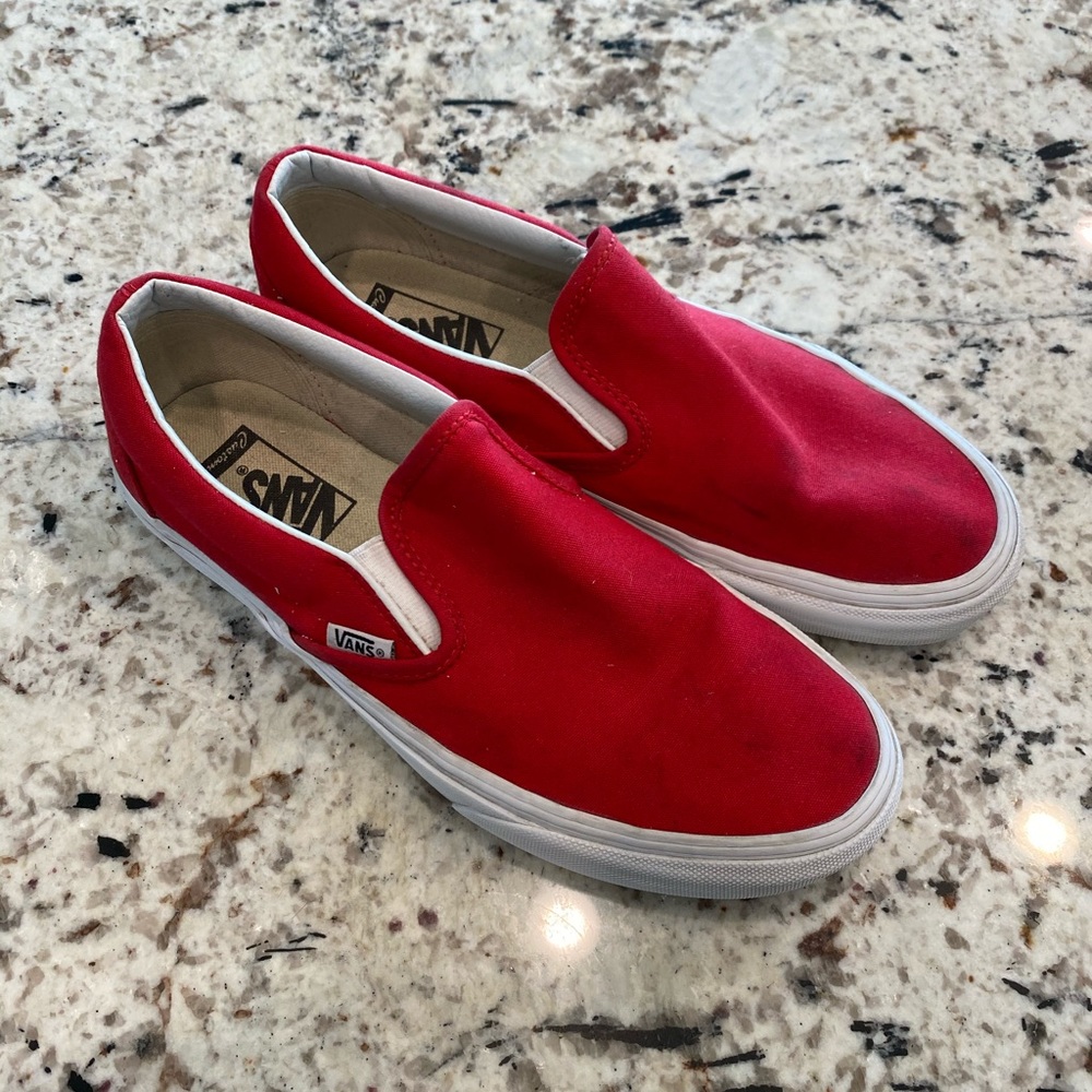 Red slip-on Vans sneakers